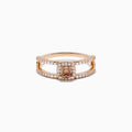 The Espresso 14K Rose Gold Brown Diamond Ring showcases a rectangular cushion-cut center stone, haloed by diamonds, and features a double band adorned with sparkling brown diamonds.