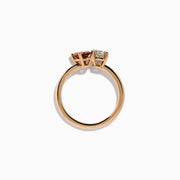 The 14K Rose Gold Brown and White Diamond Toi et Moi Ring features a square-cut white diamond and a round brown diamond set side by side in minimalist prongs on a slender band.