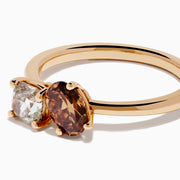 The 14K Rose Gold Brown and White Diamond Toi et Moi Ring features a square-cut white diamond and a round brown diamond set side by side in minimalist prongs on a slender band.