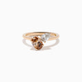 The 14K Rose Gold Brown and White Diamond Toi et Moi Ring features two side-by-side round diamonds—one brown, one white—set on a simple gold band.