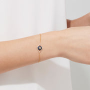 Novelty 14K Yellow Gold Sapphire & Diamond Evil Eye Bracelet, 0.43 TCW, features an eye-shaped charm with blue sapphire and diamonds, finished with a secure lobster clasp.
