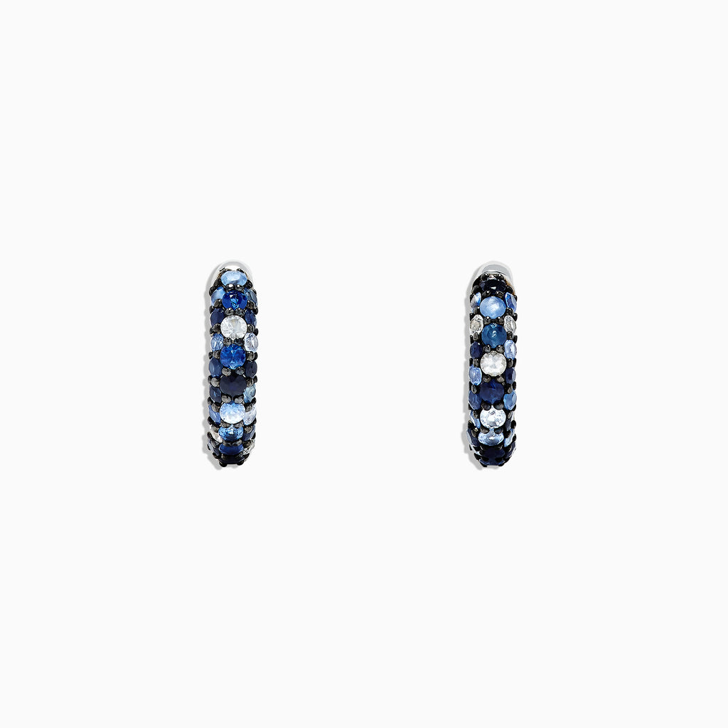 The 925 Sterling Silver Blue Sapphire Splash 1/2 Hoop Earrings, 1.77 TCW, feature alternating rows of blue sapphire and white gemstones and are shown on a plain white background.