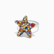 The 925 Sterling Silver Multi Sapphire Splash Starfish Ring, 2.90 TCW, features a starfish design set with vibrant blue, yellow, orange, pink, and clear sapphires—an Effy piece that dazzles against a white backdrop.