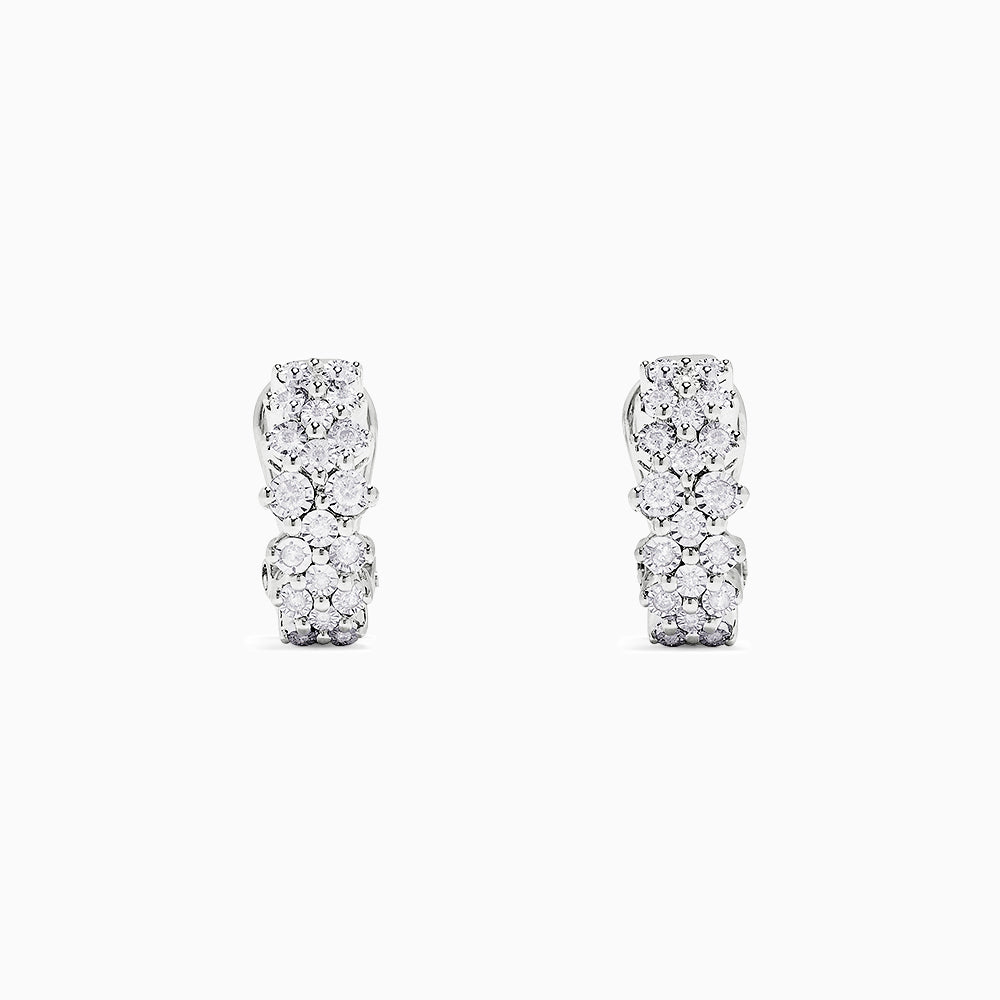 A pair of 925 sterling silver diamond earrings, featuring three rows of sparkling round diamonds totaling 0.33 TCW, shown against a plain white background.