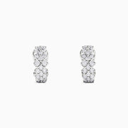 A pair of 925 sterling silver diamond earrings, featuring three rows of sparkling round diamonds totaling 0.33 TCW, shown against a plain white background.