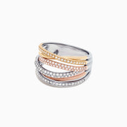The Trio 14K Tri-Color Gold Pave Diamond Crossover Ring (0.54 TCW) features intertwined yellow, rose, and white gold bands, each sparkling with pave-set diamonds, arranged on a white background.