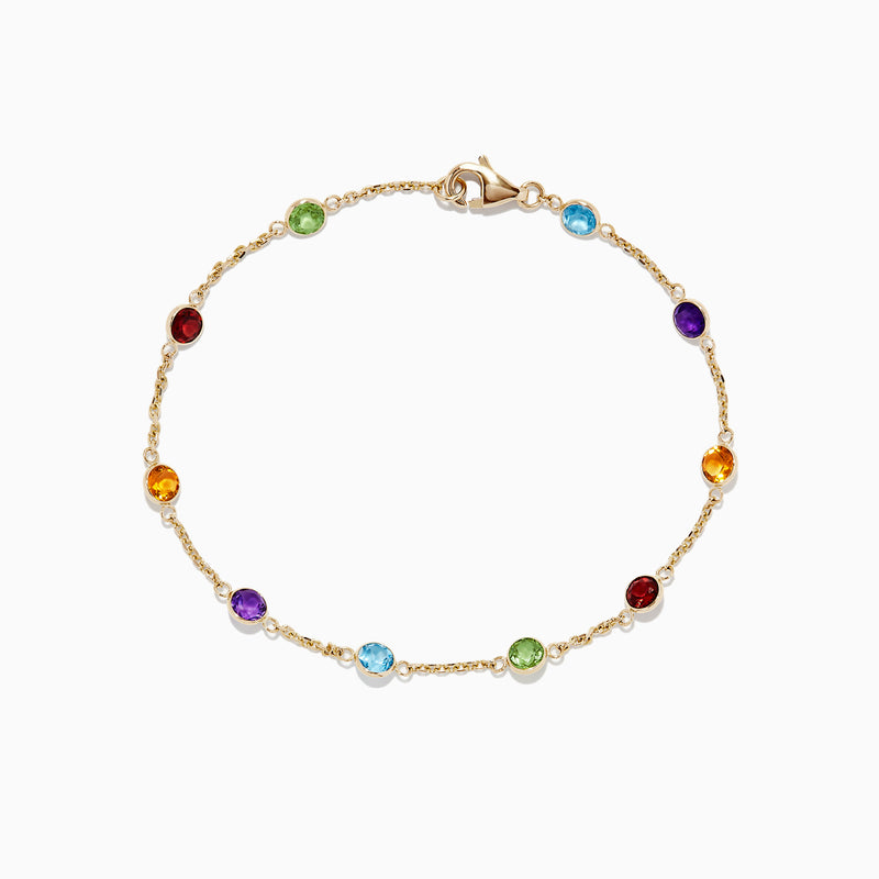 The Mosaic 14K Yellow Gold Multi Gemstone Station Bracelet, 2.47 TCW, features round red, green, blue, purple, and amber gemstones spaced along a delicate chain with a secure lobster clasp.