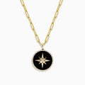The Novelty 14K Yellow Gold Onyx and Diamond Star Coin Pendant (4.49 TCW) features a striking round onyx and diamond starburst design encircled by a halo of sparkling stones.