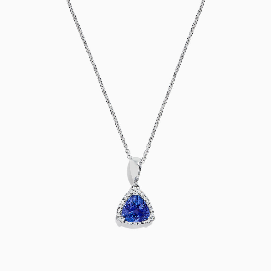 The Nahla Siri 14K White Gold Tanzanite and Diamond Trillion Pendant (0.72 TCW) features a triangular blue tanzanite framed by diamonds, displayed on a fine chain against a white background.