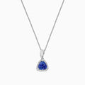 The Nahla Siri 14K White Gold Tanzanite and Diamond Trillion Pendant (0.72 TCW) features a triangular blue tanzanite framed by diamonds, displayed on a fine chain against a white background.