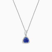 The Nahla Siri 14K White Gold Tanzanite and Diamond Trillion Pendant (0.72 TCW) features a triangular blue tanzanite framed by diamonds, displayed on a fine chain against a white background.