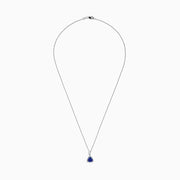 The Nahla Siri 14K White Gold Tanzanite and Diamond Trillion Pendant (0.72 TCW) features a triangular blue tanzanite framed by diamonds, displayed on a fine chain against a white background.