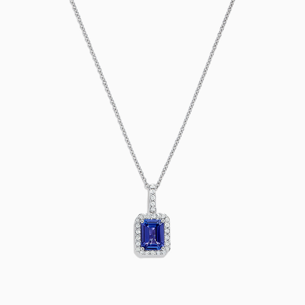 The Nahla Siri 14K White Gold Tanzanite and Diamond Pendant, 1.56 TCW, features a rectangular tanzanite surrounded by sparkling diamonds, elegantly displayed against a white background.