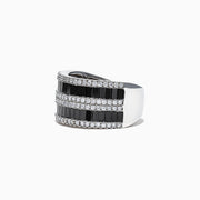 The 14K White Gold Black and White Diamond Ring, 2.48 TCW, features alternating rows of rectangular black and white diamonds in a sleek band, elegantly displayed against a white background.