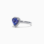 The Nahla Siri 14K White Gold Tanzanite and Diamond Heart Ring, 2.38 TCW, features a heart-shaped blue tanzanite center surrounded by a halo of diamonds and additional diamonds set along the band.