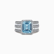 The Aquarius 14K White Gold Diamond and Aquamarine Ring showcases a large rectangular light blue aquamarine center stone, accented by multiple rows of clear baguette and round-cut diamonds along the band.