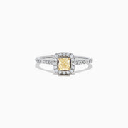 The Canare 18K Two-Tone Gold Cushion Halo Yellow Diamond Ring features a 0.61 TCW square yellow diamond center, surrounded by a halo of clear diamonds and additional diamonds on the band.
