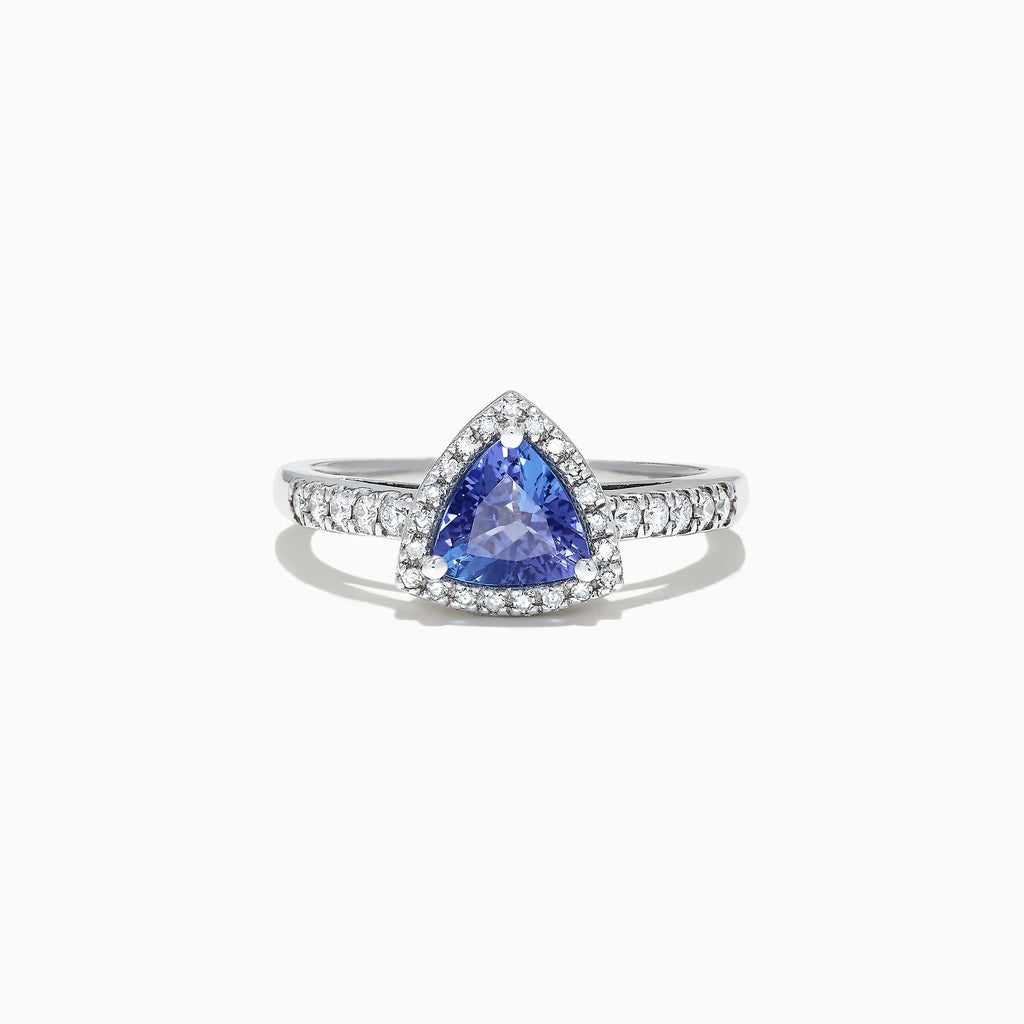 The Nahla Siri 14K White Gold Trillion Tanzanite and Diamond Ring, 0.96 TCW, showcases a triangular blue tanzanite center with a halo and band of sparkling white diamonds, presented on a white background.