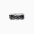 The 14K White Gold Black and White Diamond Ring, 1.28 TCW, features three rows of round black stones in the center, bordered on top and bottom by single rows of sparkling white diamonds.