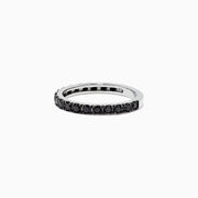 The 14K White Gold Black Diamond Stack Ring, 0.65 TCW, features small round black diamonds encircling the band and is shown against a white background.