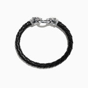 The Mens Sterling Silver and Leather Diamond Accented Panther Bracelet 0.16 TCW features braided black leather, sterling silver panther head end caps, a silver clasp, and is shown on a white background.