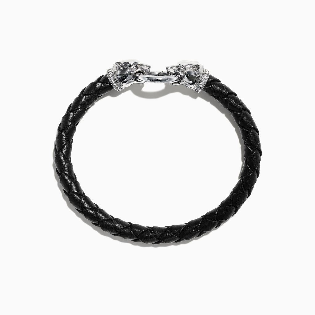 The Mens Sterling Silver and Leather Diamond Accented Panther Bracelet 0.16 TCW features braided black leather, sterling silver panther head end caps, a silver clasp, and is shown on a white background.