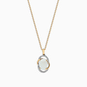 The Aurora 14K Two Tone Gold Opal and Diamond Pendant (1.49 TCW) features an oval opal centerpiece, accented by gold and silver loops with sparkling diamonds highlighting the silver sections.