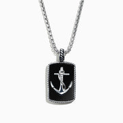 The Mens Sterling Silver Onyx Anchor Dog Tag Pendant, 18.85 TCW, features a rectangular onyx center with a raised silver anchor and rope-like border, creating a bold and striking accessory for men.