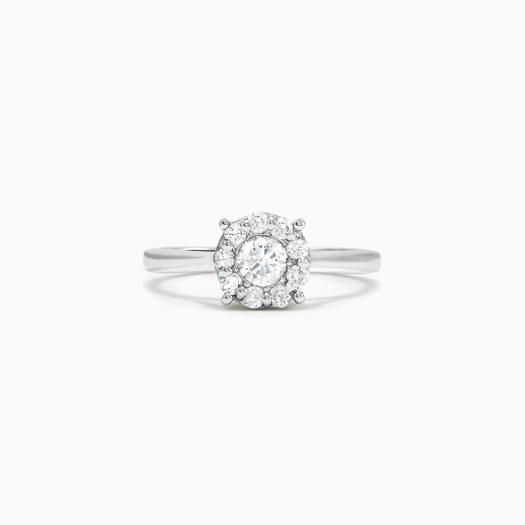 The Bouquet 14K White Gold Diamond Cluster Ring, 0.51 TCW, showcases a brilliant round center diamond framed by a halo of smaller diamonds, beautifully presented against a plain white background.