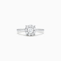 The Bouquet 14K White Gold Diamond Cluster Ring, 0.51 TCW, showcases a brilliant round center diamond framed by a halo of smaller diamonds, beautifully presented against a plain white background.