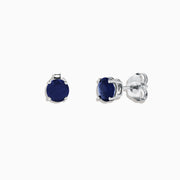 The Royale Bleu 14K White Gold Sapphire Stud Earrings, 2.00 TCW, feature round deep blue stones set in white gold prongs, displayed against a plain white background.