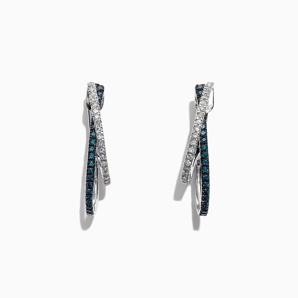 The Bella Bleu 14K White Gold Blue and White Diamond Earrings, 0.58 TCW, feature two intertwined hoops—one adorned with blue and white diamonds—and are displayed against a white background.
