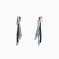 The Bella Bleu 14K White Gold Blue and White Diamond Earrings, 0.58 TCW, feature two intertwined hoops—one adorned with blue and white diamonds—and are displayed against a white background.