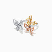 The Trio 14K Tri Color Gold Diamond Butterfly Ring, 0.66 TCW, showcases three butterflies in yellow, white, and rose gold tones with sparkling diamonds, elegantly set against a white backdrop.