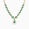 The Brasilica 14K Yellow Gold Emerald and Diamond Necklace, 9.74 TCW, features oval emeralds accented with diamonds and a central teardrop-shaped emerald pendant surrounded by a sparkling diamond halo.