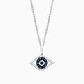 The Novelty 14K White Gold Sapphire & Diamond Evil Eye Pendant (0.42 TCW) features blue sapphires and diamonds in a striking, stylized concentric circle design.