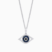 The Novelty 14K White Gold Sapphire & Diamond Evil Eye Pendant (0.42 TCW) features blue sapphires and diamonds in a striking, stylized concentric circle design.