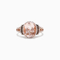 The 14K Rose Gold Morganite and Diamond Ring, 3.42 TCW, showcases a striking oval morganite center stone encircled by a double halo of white and black diamonds, with additional sparkling diamonds on the split shank.
