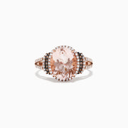 The 14K Rose Gold Morganite and Diamond Ring, 3.42 TCW, showcases a striking oval morganite center stone encircled by a double halo of white and black diamonds, with additional sparkling diamonds on the split shank.