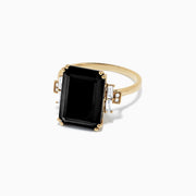 The Eclipse 14K Yellow Gold Onyx and Diamond Ring, 6.73 TCW, features a striking rectangular black onyx center accented by baguette and round diamonds, all set on a polished yellow gold band.