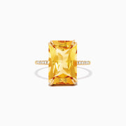 The Sunset 14K Yellow Gold Citrine and Diamond Ring, 6.72 TCW, features a large rectangular citrine center stone with small round diamonds set on a slim band, shown against a white background.