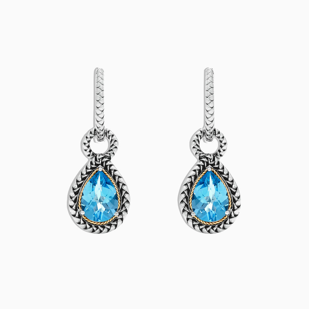 A pair of 925 sterling silver and 18K yellow gold earrings with blue topaz gemstones, 4.56 TCW, shown on a white background.
