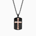 The Mens Rhodium Sterling Silver and Rose Gold Plated Cross Pendant features a black dog tag with a raised rose gold cross at the center, on a black chain, displayed against a white background.