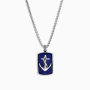 The Mens Sterling Silver Lapis Lazuli Anchor Dog Tag Pendant (18.85 TCW) features a silver anchor design set on deep blue lapis lazuli and is framed with a textured sterling silver border.
