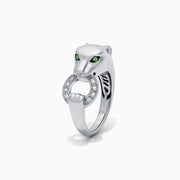 The Signature Sterling Silver Diamond and Tsavorite Panther Ring, 0.13 TCW, features green gemstone eyes and a diamond-studded ring in its mouth. Displayed on a plain white background.