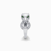 The Signature Sterling Silver Diamond and Tsavorite Panther Ring, 0.13 TCW, features green gemstone eyes and a diamond-studded ring in its mouth. Displayed on a plain white background.