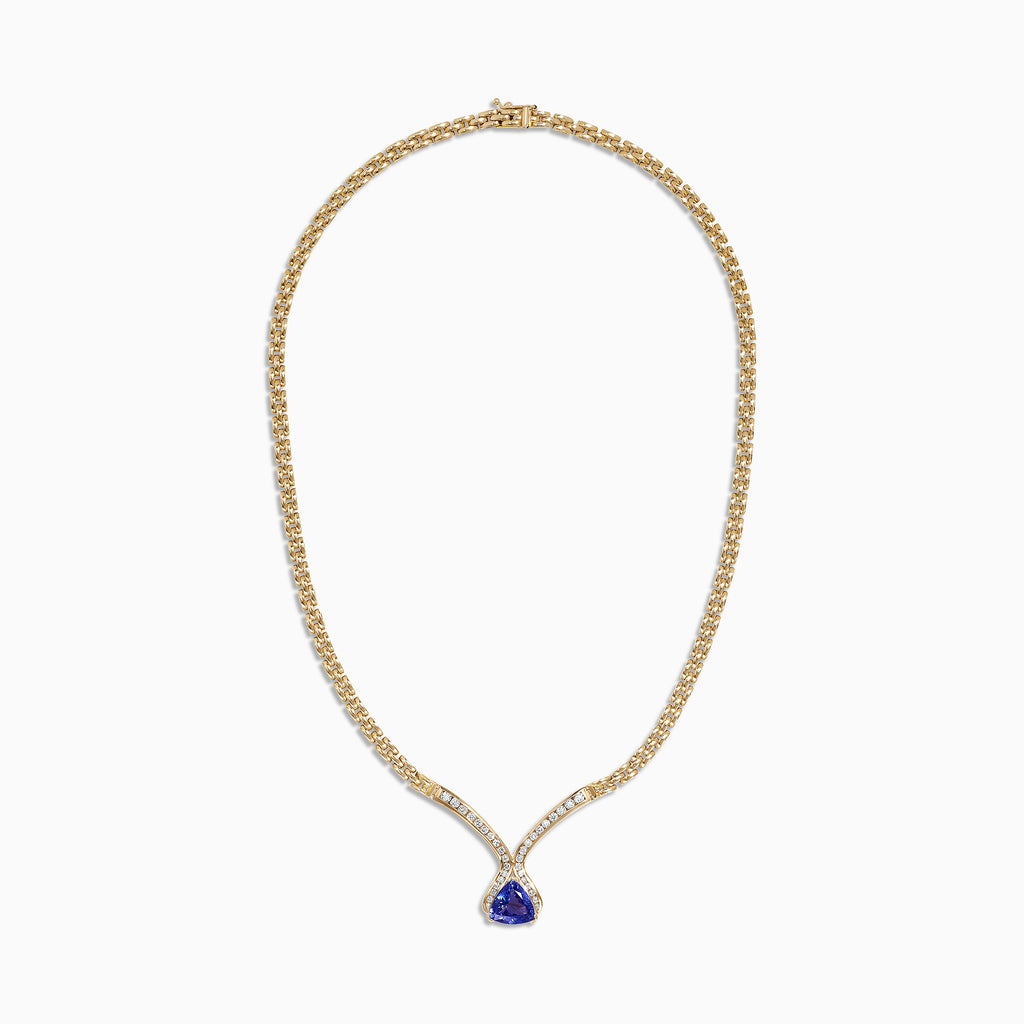 The Nahla Siri 14K Yellow Gold Tanzanite and Diamond Necklace (3.66 TCW) features a teardrop tanzanite pendant encircled by diamonds, with additional diamonds set along the chain for an elegant touch.