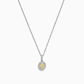 The Canare 18K Two-Tone Gold Oval Yellow Diamond Pendant (0.46 TCW) features a vivid yellow diamond encircled by sparkling stones, blending timeless elegance with modern design.