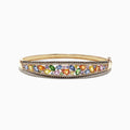 The Watercolors 14K Yellow Gold Multi Sapphire & Diamond Bangle, 6.02 TCW, features a row of multicolored sapphires in various shapes, edged with sparkling round diamonds for a vibrant and elegant look.