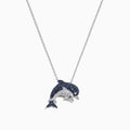 The Seaside 14K White Gold Sapphire & Diamond Dolphins Pendant (0.71 TCW) features sapphire-blue and diamond-clear stones in a dolphin design, displayed on a white background.